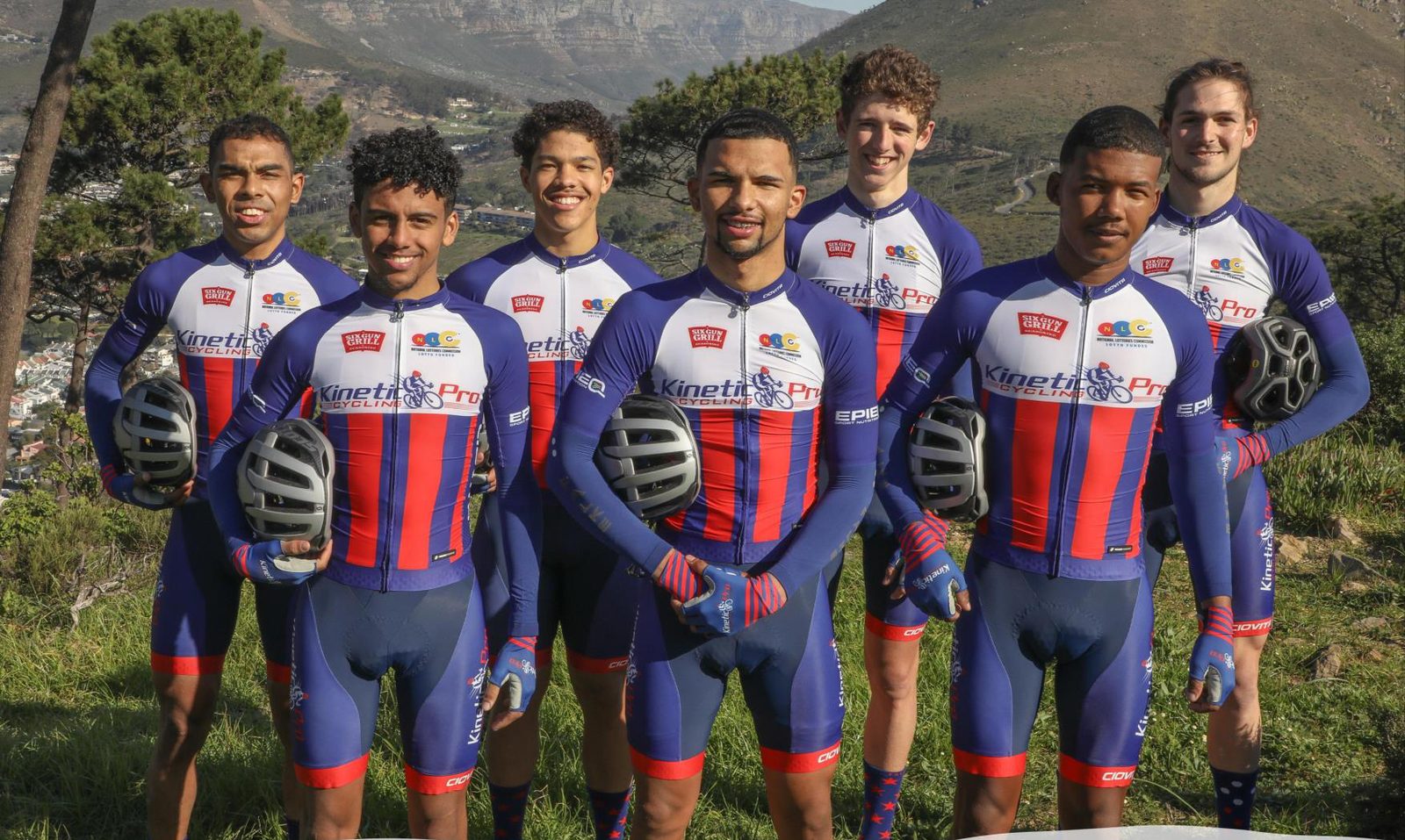 The 2021 Kinetic race team in red and blue kit, with Lion's Head behind them